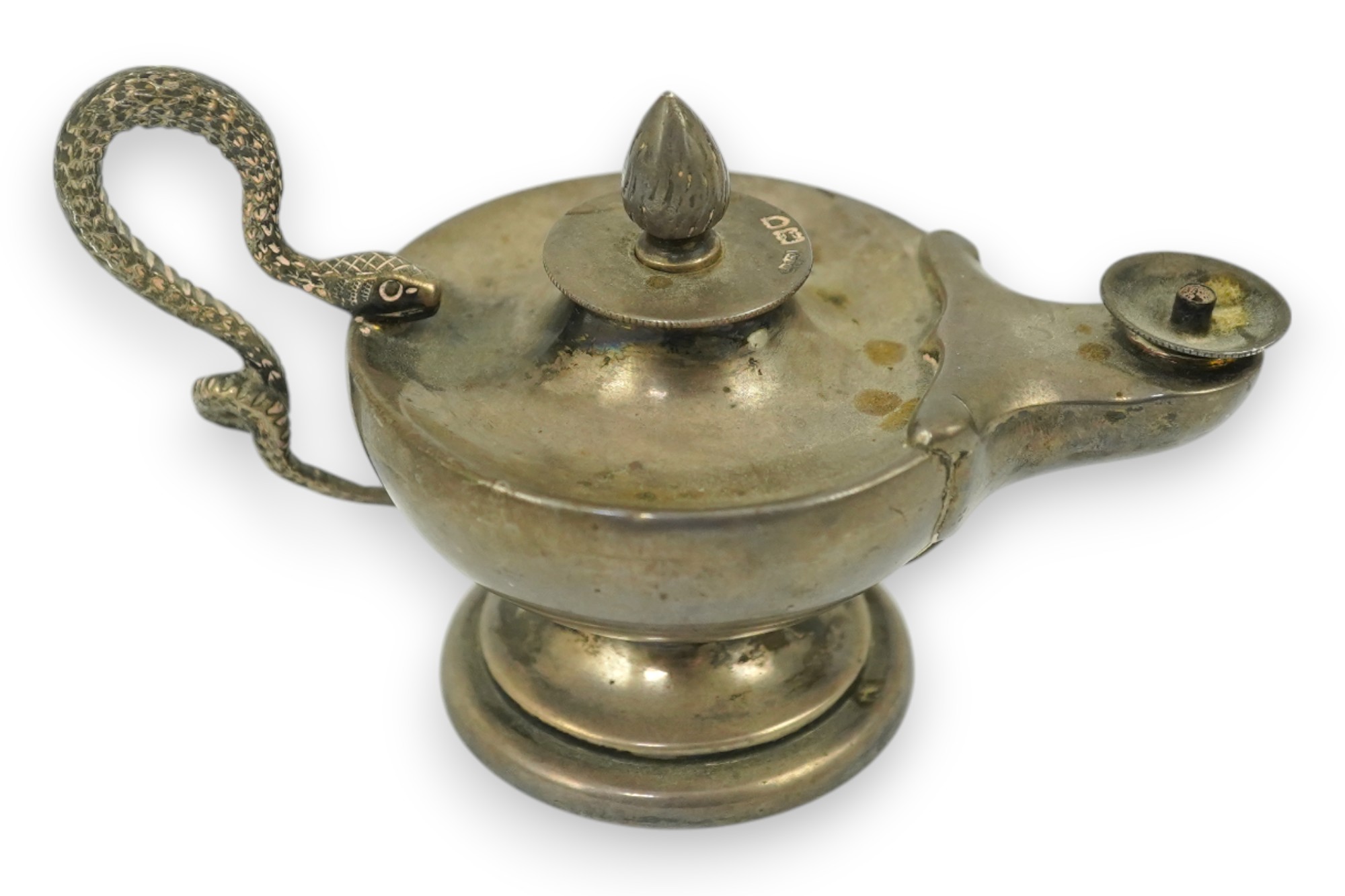 A late Victorian silver club lighter modelled as an oil lamp with serpent handle, Goldsmiths & Silversmiths Co Ltd, London, 1900, length 12cm. Condition - fair to good